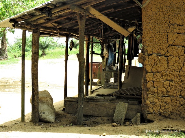 Various items hung under the eaves, Bong, Liberia, April 2017
