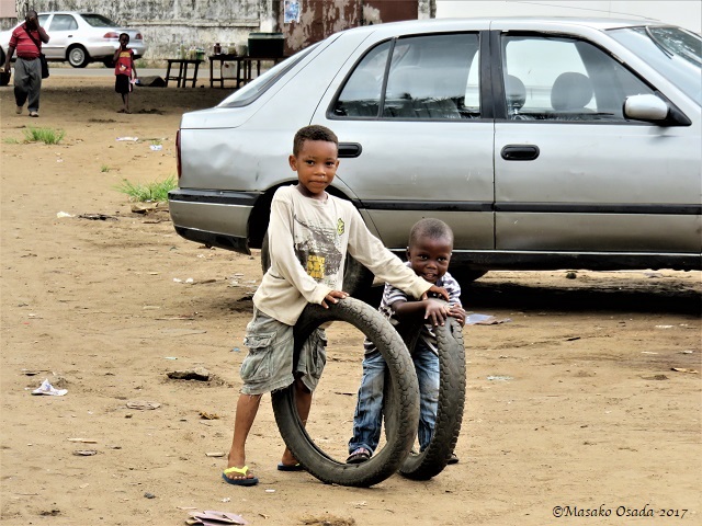 Boys playing with tyres, Monrovia, Liberia, April 2017