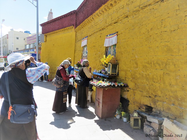 Praying. Near Potala Palace, Lhasa, Tibet, September 2018