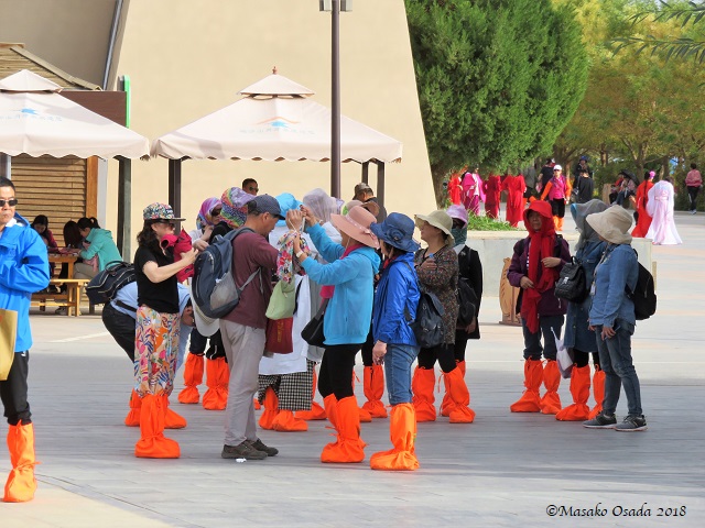 Red Boots Brigade. Mingsha Mountain Crescent Spring Resort, Dunhuang, Gansu, September 2018