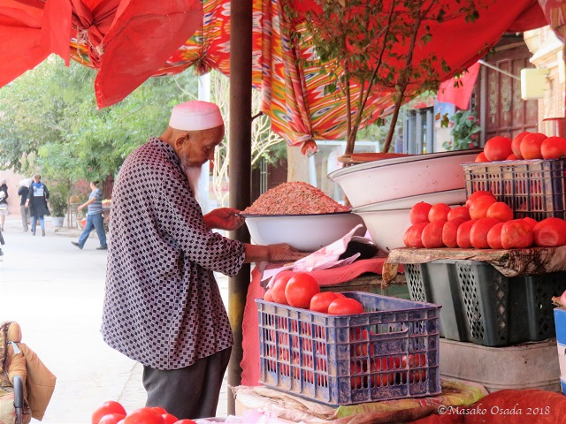 Fruit seller. Old City, Kashgar, Xinjiang, September 2018