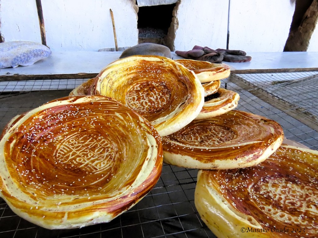 Freshly baked bread. On the way to Margilan, Uzbekistan