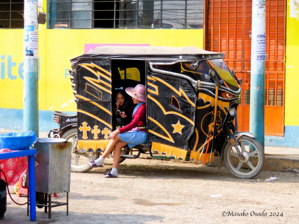Stylish lady in a mototaxi. Pacaguilla